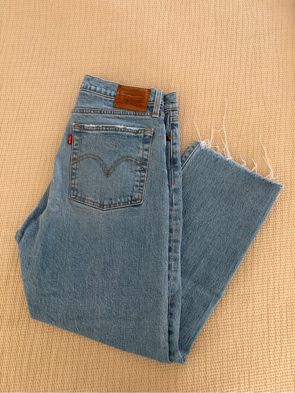 Levi's Women's Straight-Leg Jeans in Light Blue Denim with Frayed Hem